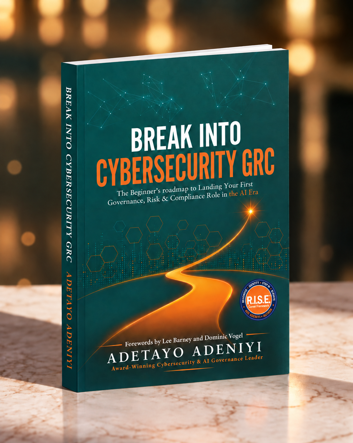 Break Into Cybersecurity GRC paperback standing on a marble surface